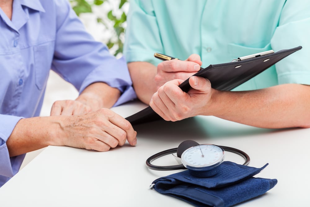 A doctor analyzing results of a pressure measuring A doctor analyzing results of a pressure measuring