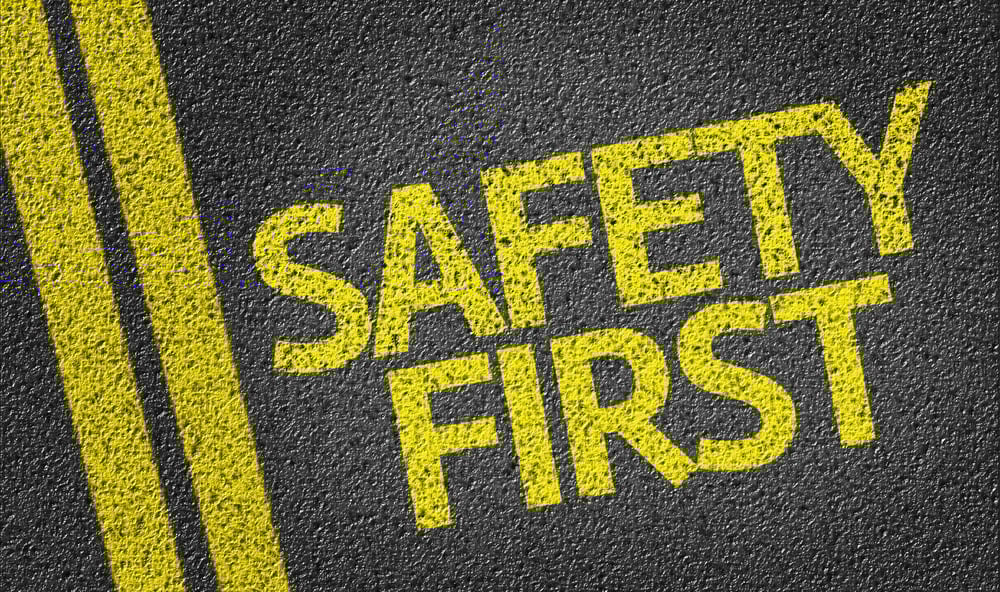 Safety First written on the road Safety First written on the road