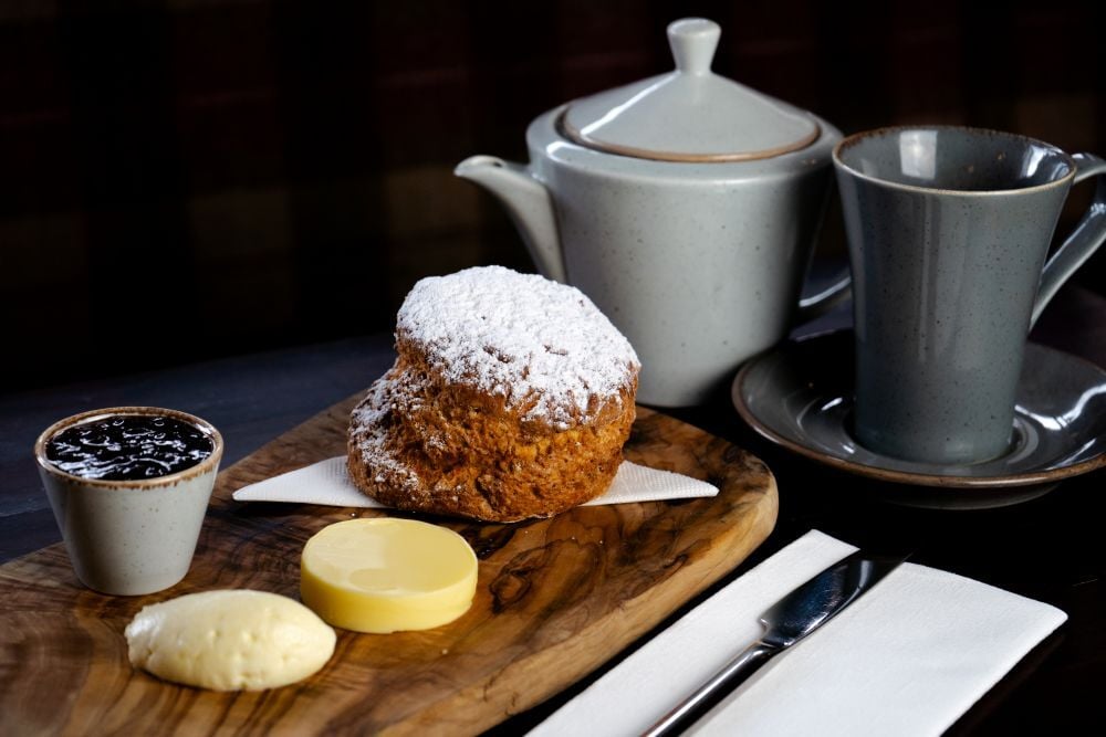 Fresh baked scone with butter and jam served with tea at The Lakeside Manor restaurant in Virginia, County Cavan.