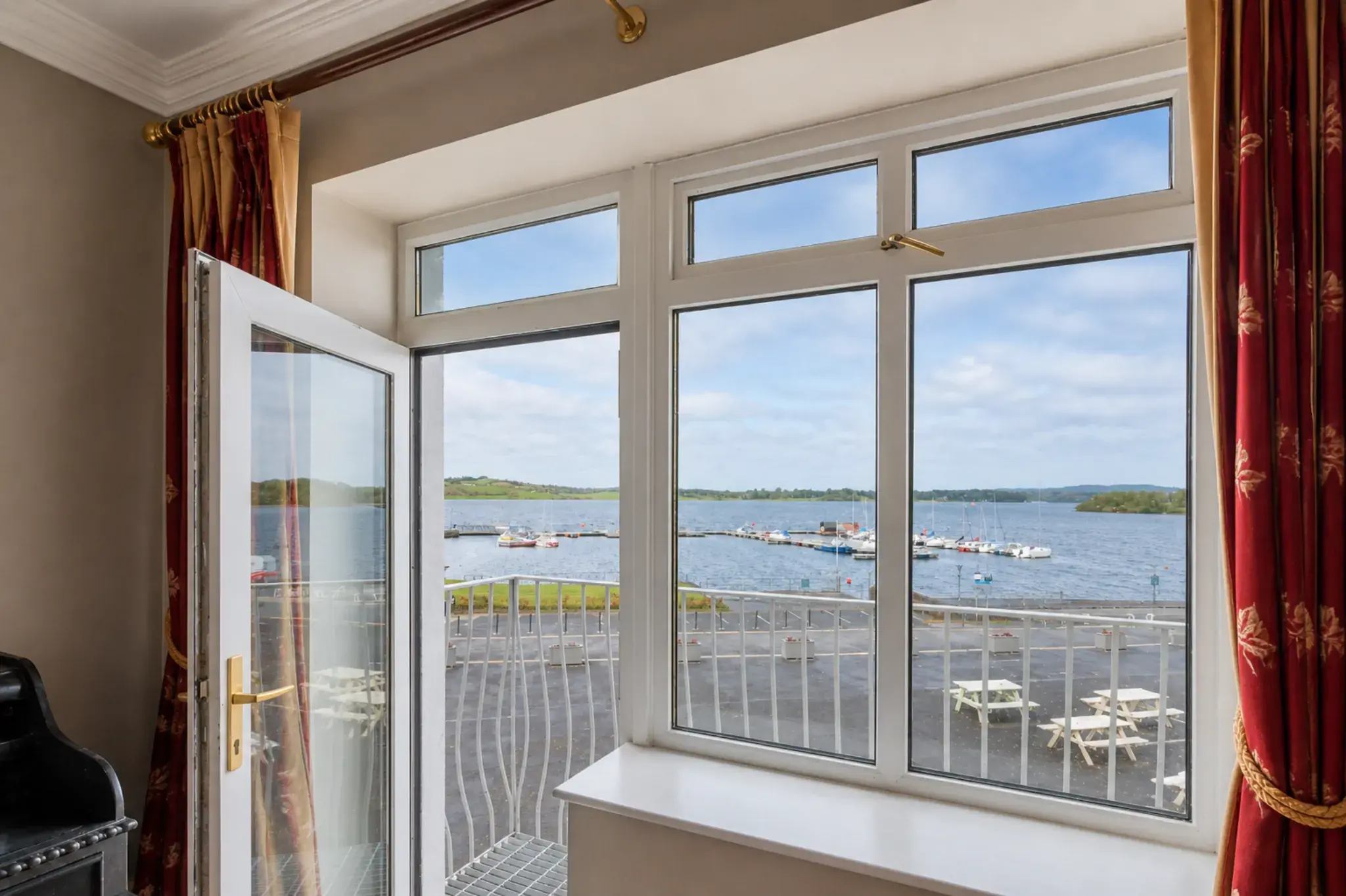 Hotel room with balcony doors overlooking the marina on Lough Ramor